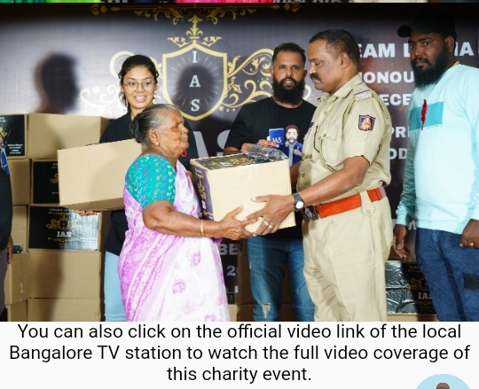 An officer is handing some goods to a lady